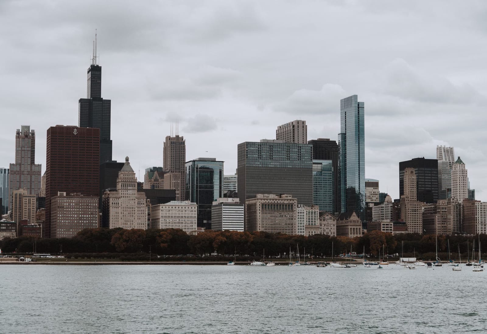 The Chicago skyline seen across open water on an overcast day